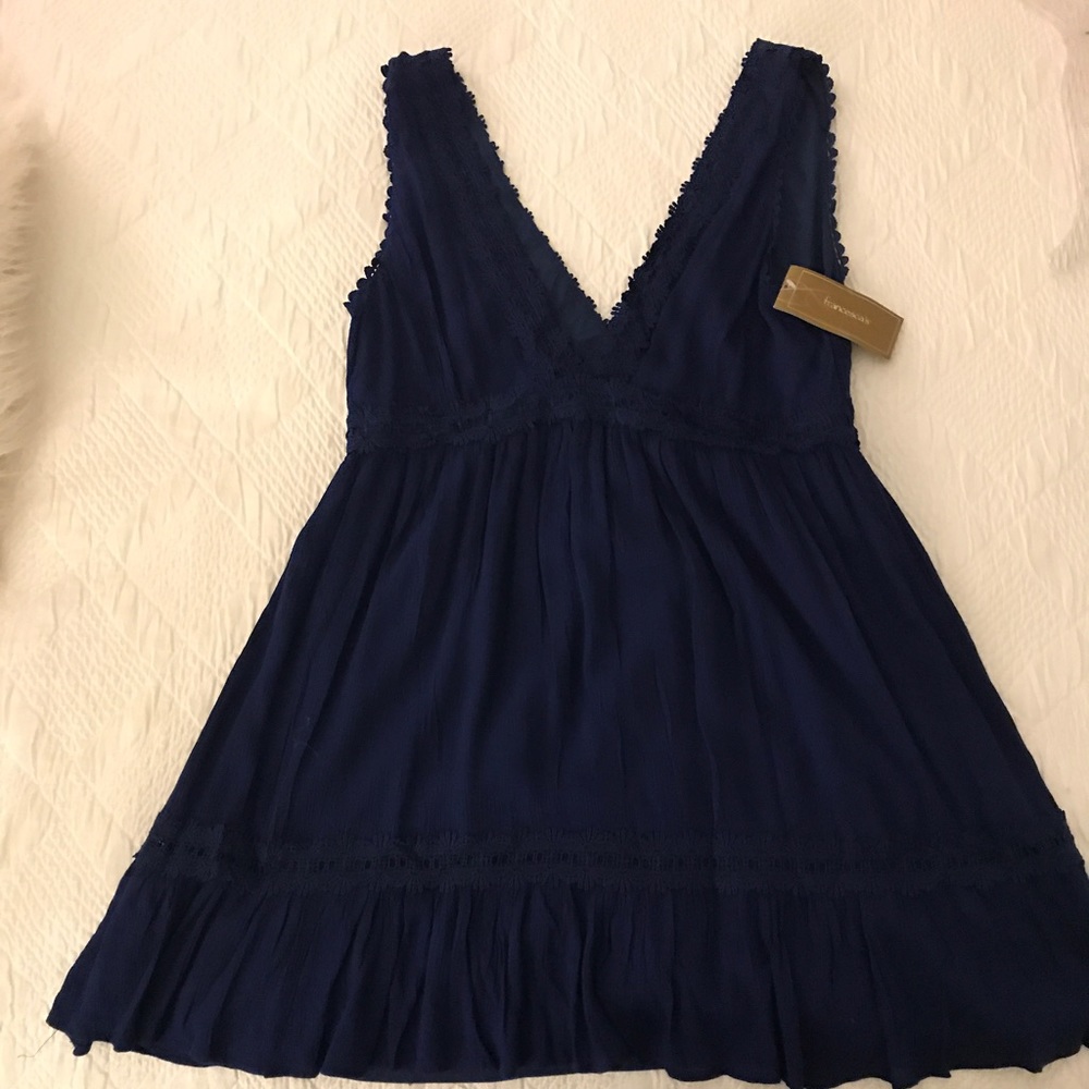 Never worn navy blue flows dress!