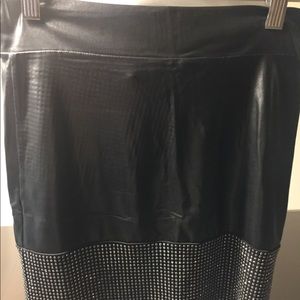 Small bebe mini skirt with rhinestone detail.