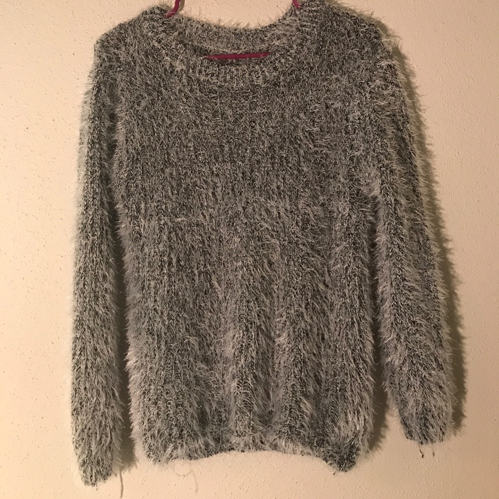 Grey and white sweater. Has not been used.