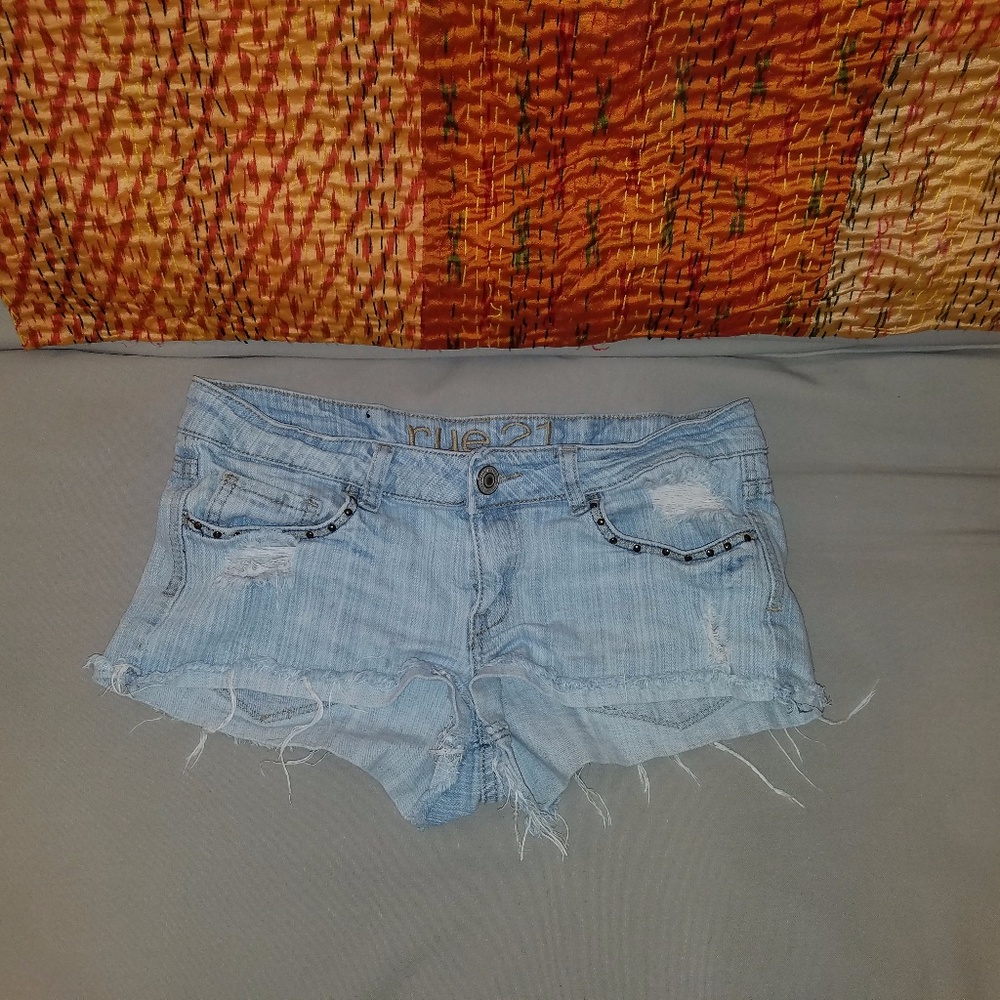 Ripped blue jean shorts