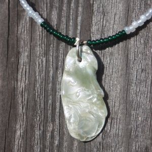 Green shell pendant with seed beads (item#1)