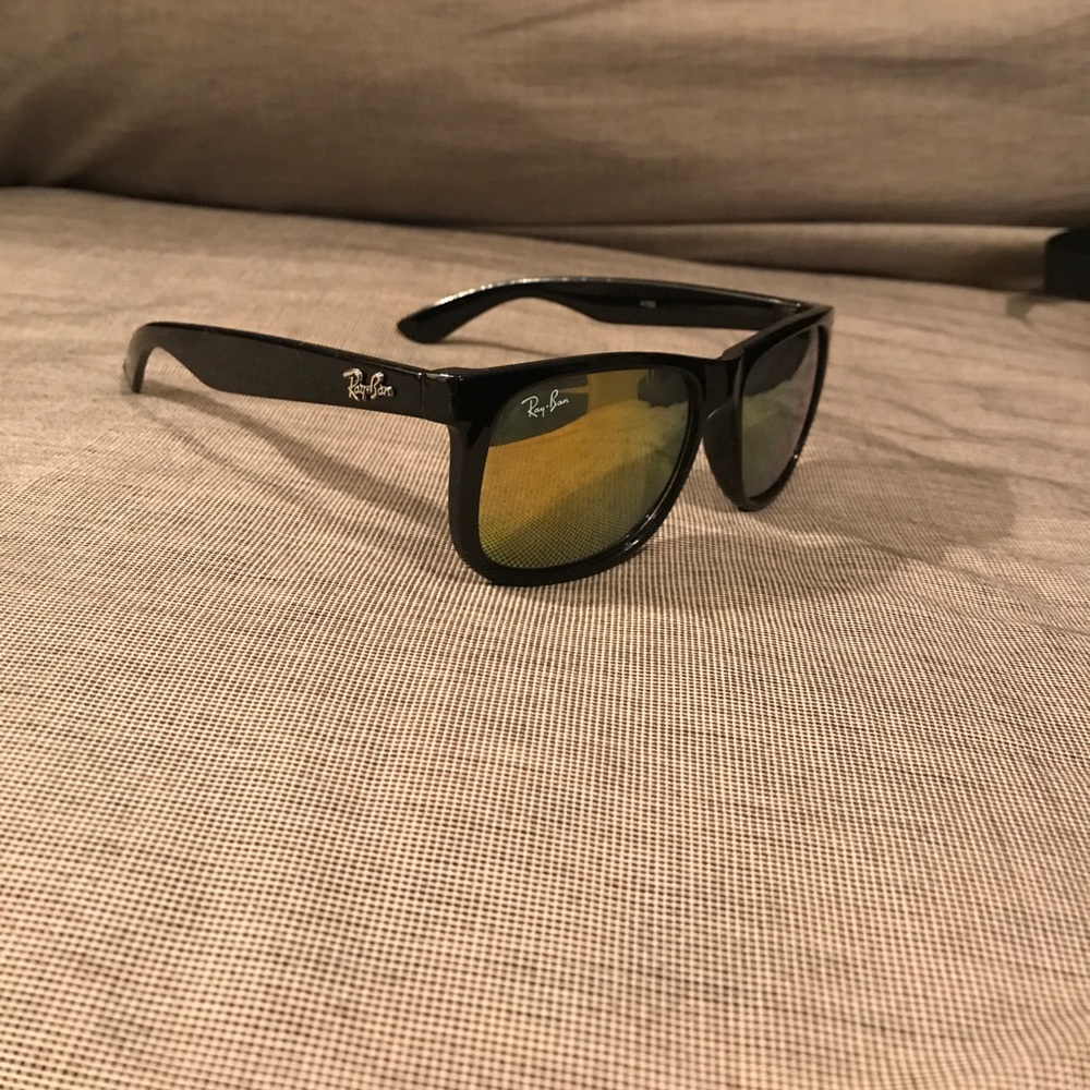 Black Ray bans with gold lenses