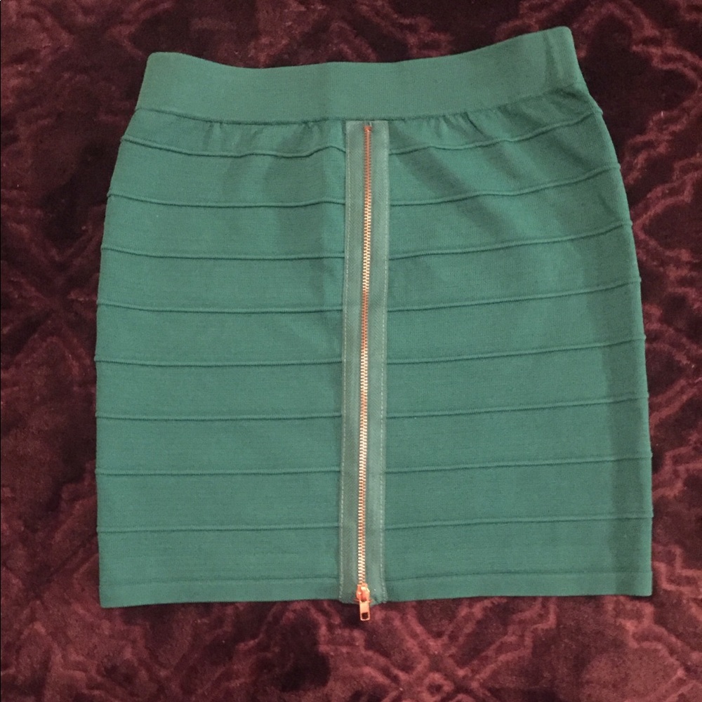 Turquoise green miniskirt.  Zipper in front.