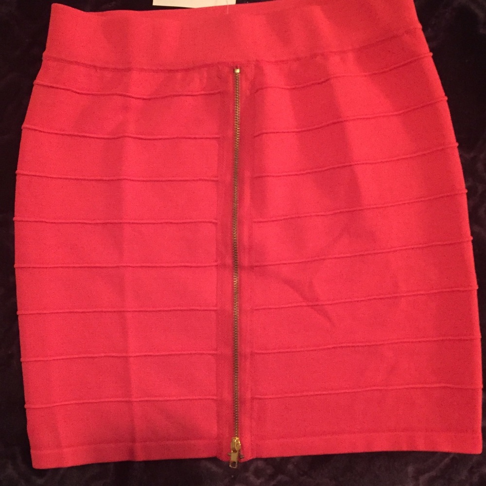 Salmon colored miniskirt.  Zipper in front.  New.