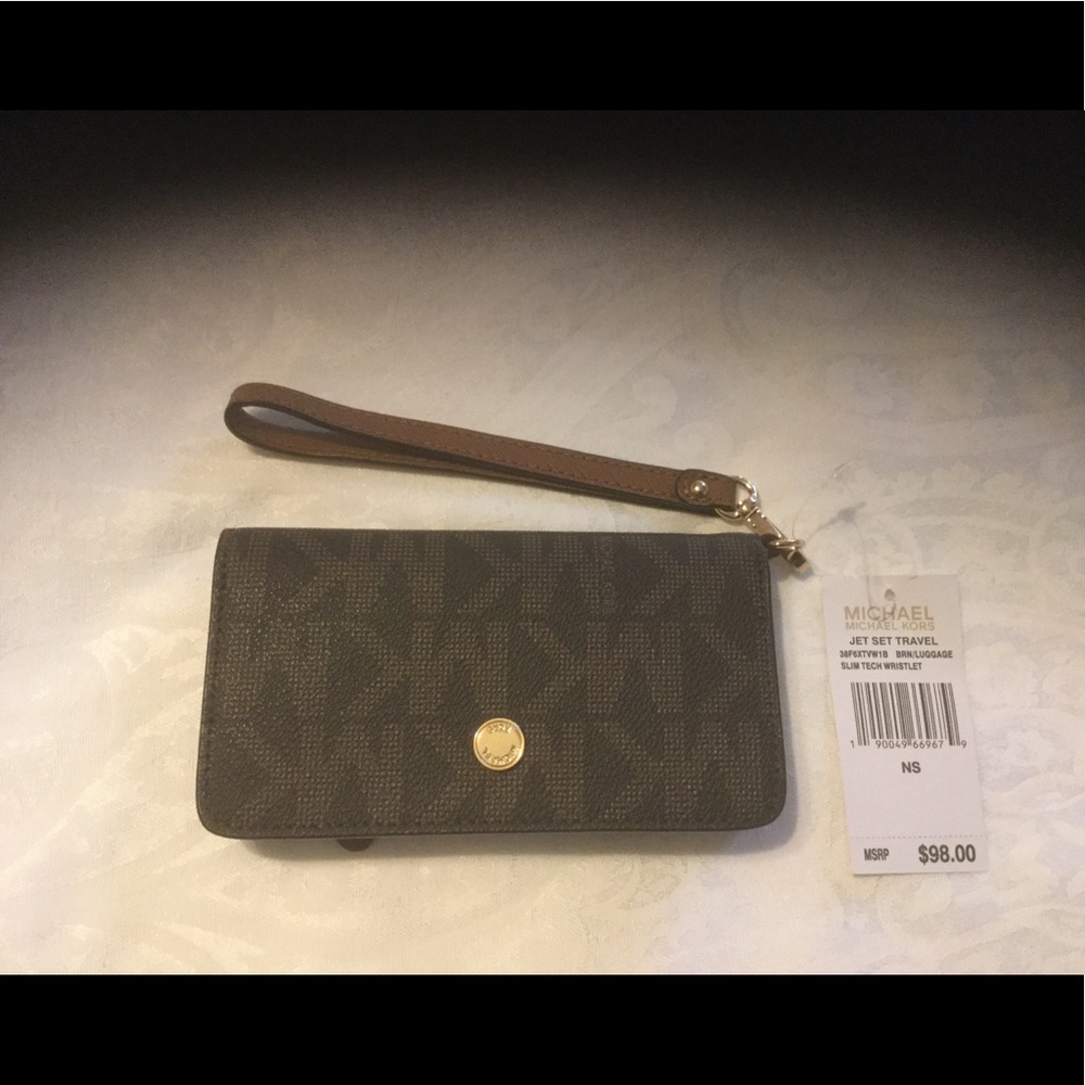 NWT. Michael Kors Slim tech Wristlet in Brown