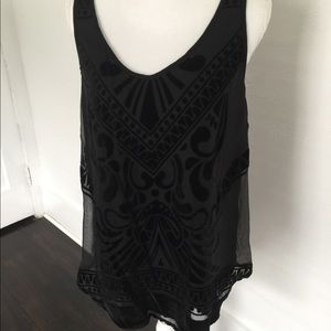 Sleeveless black overlay top