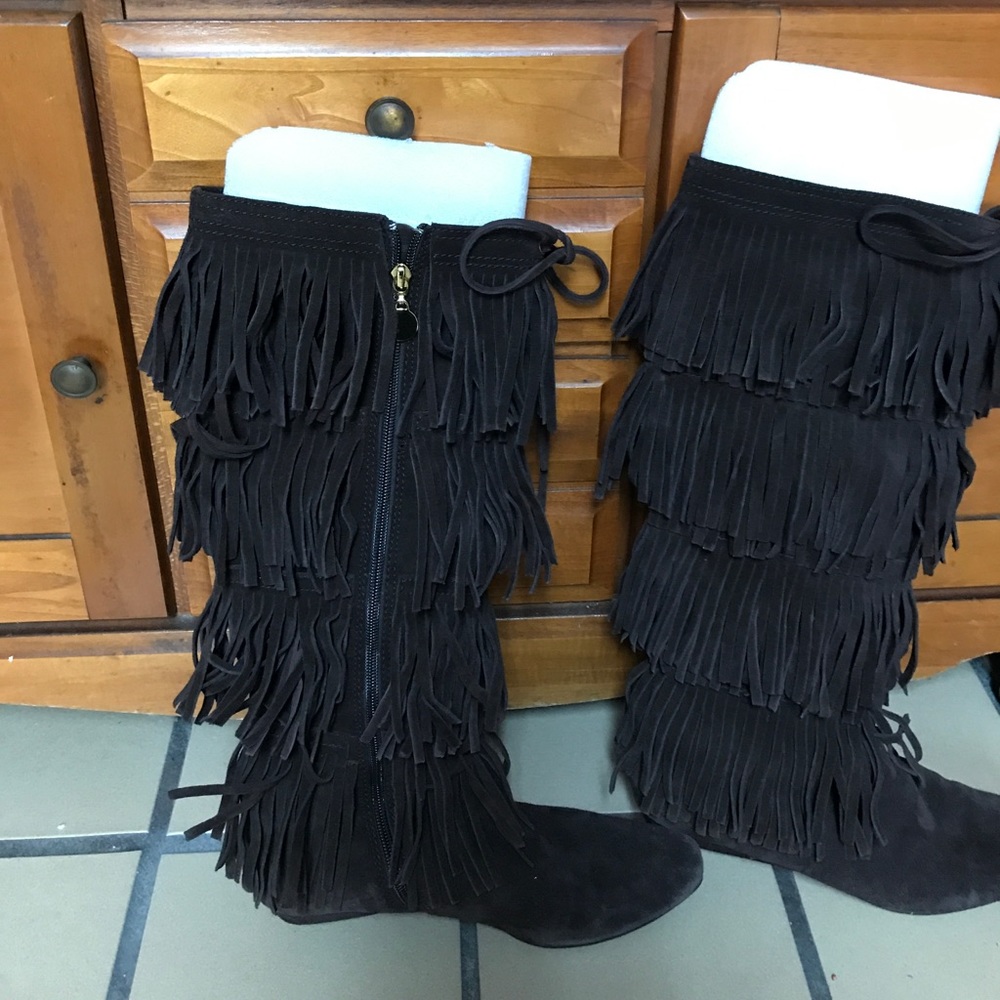 Michael Kors “Montreal” suede fringed boots.