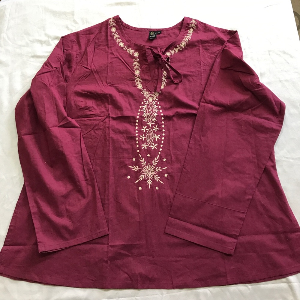 Woman's burgundy top. New without tags
