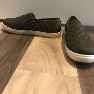 Green slip on sneakers
