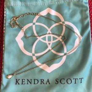 Kendra Scott gold with white stone
