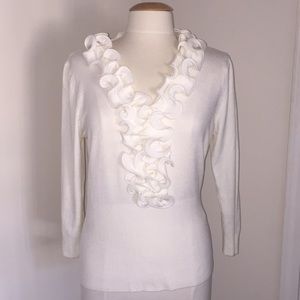 White ruffled blouse