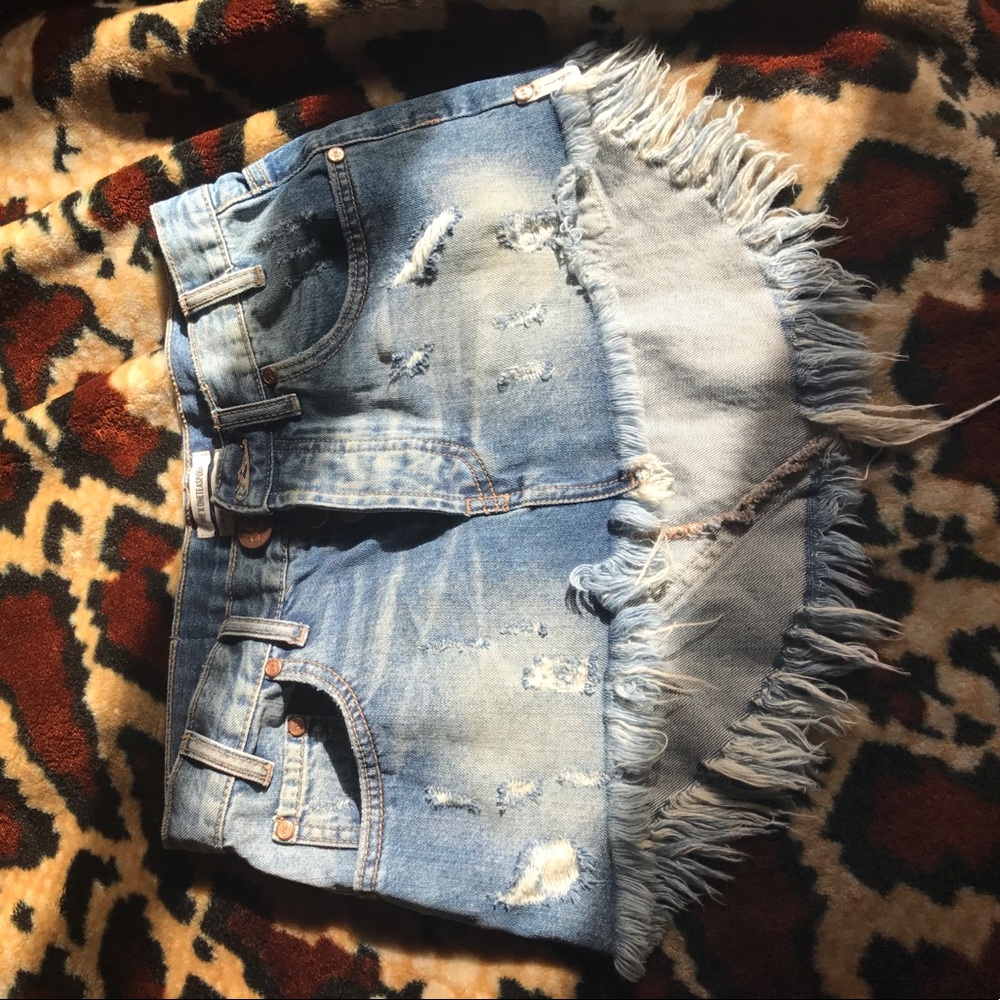 Denim low rise distressed fringe skirt curved hem