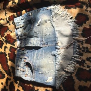 Denim low rise distressed fringe skirt curved hem