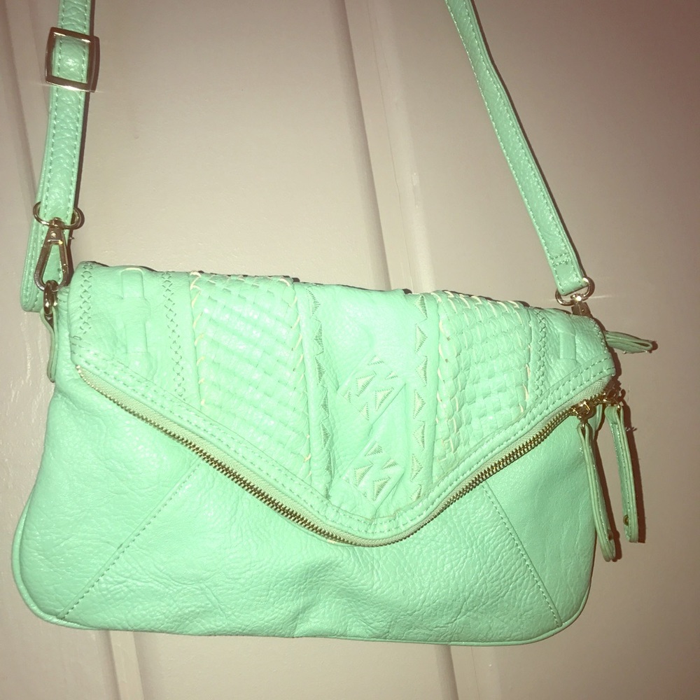 Mint green crossbody bag with cutout details