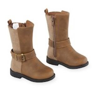 Hard sole brown harness boot with buckle detail.