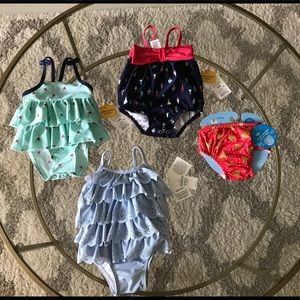 NWT Baby girl swimsuits. Size range 0-6 months.