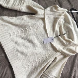 Off the shoulder cozy sweater .