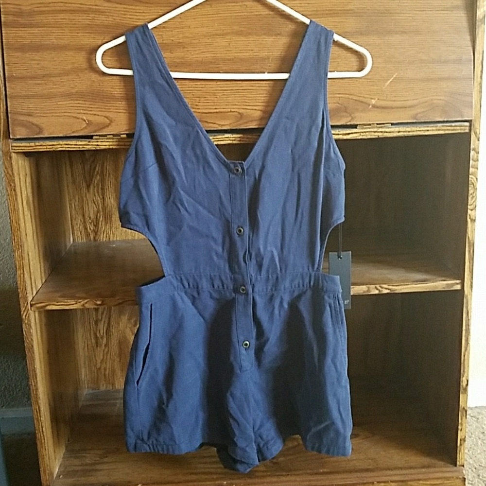 Blue denim romper with open sides