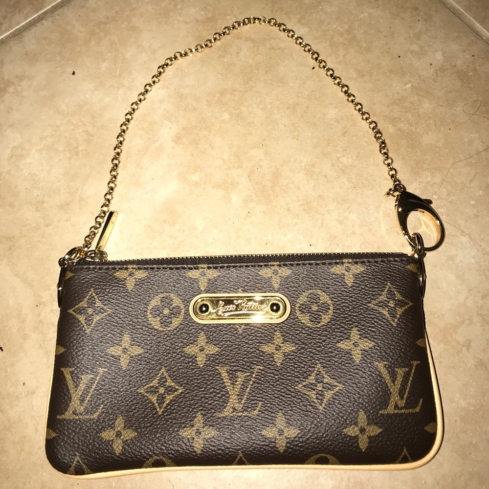 Louis Vuitton wristlet BRAND NEW NEVER USED!!