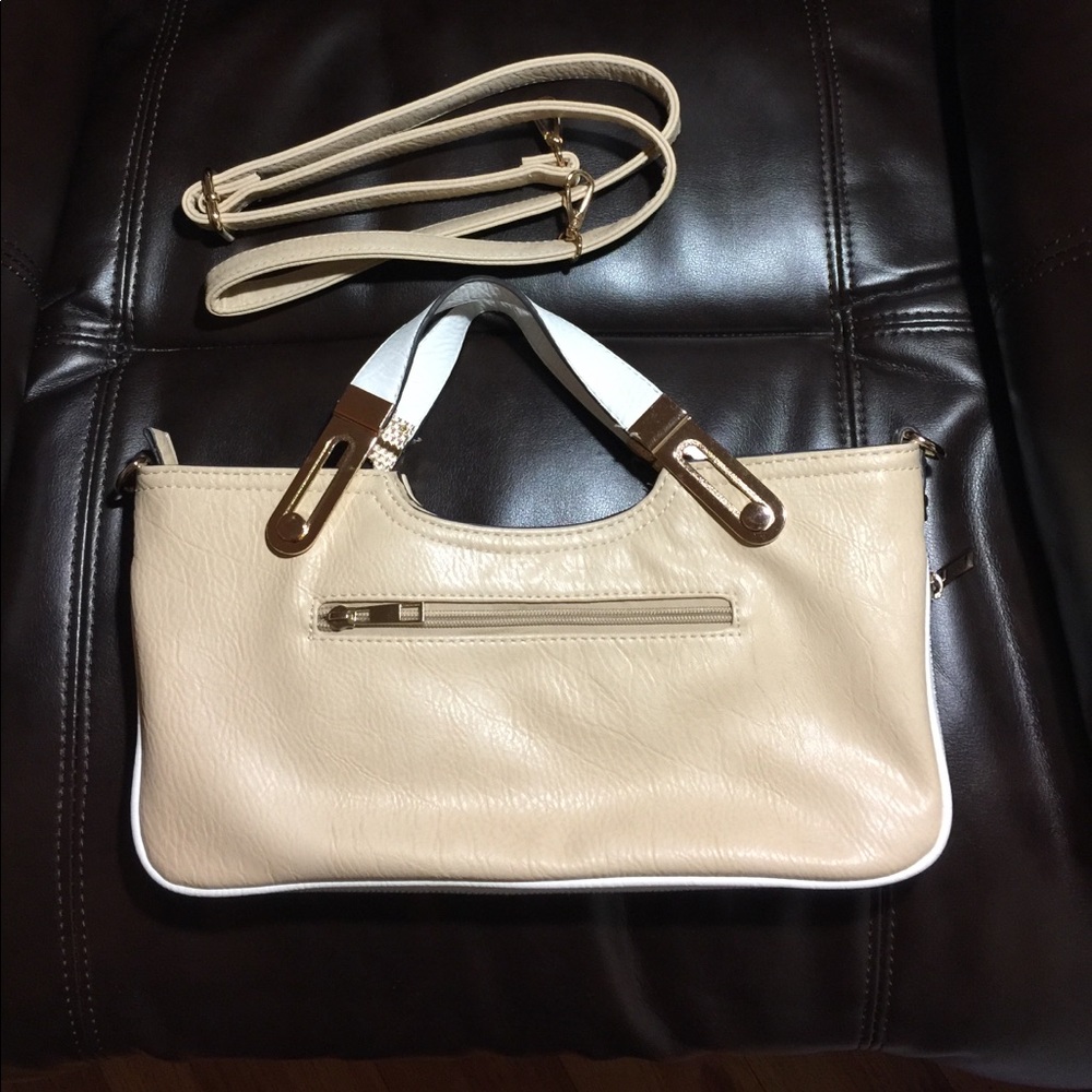 Tan faux leather adjustable purse with white trim