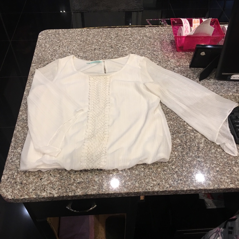 White blouse w/ lace detail up the front