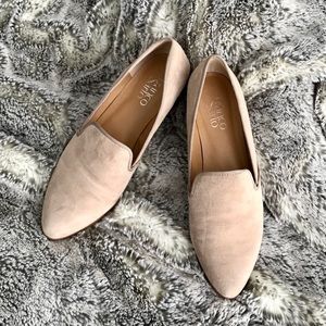 Carefully worn tan flats