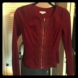 Maroon zip up top. Never worn.