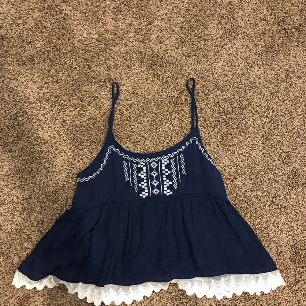 Blue flowy top with white lace trim