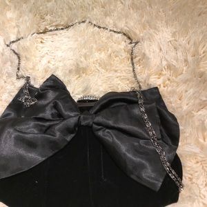 Neiman Marcus black clutch with a bow