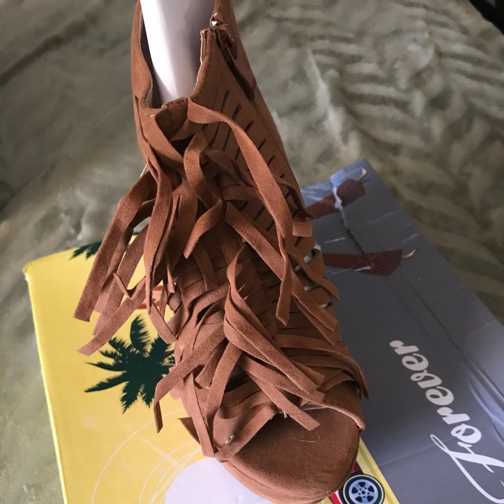 Brand new fringe wedge heel sandals comes in box.