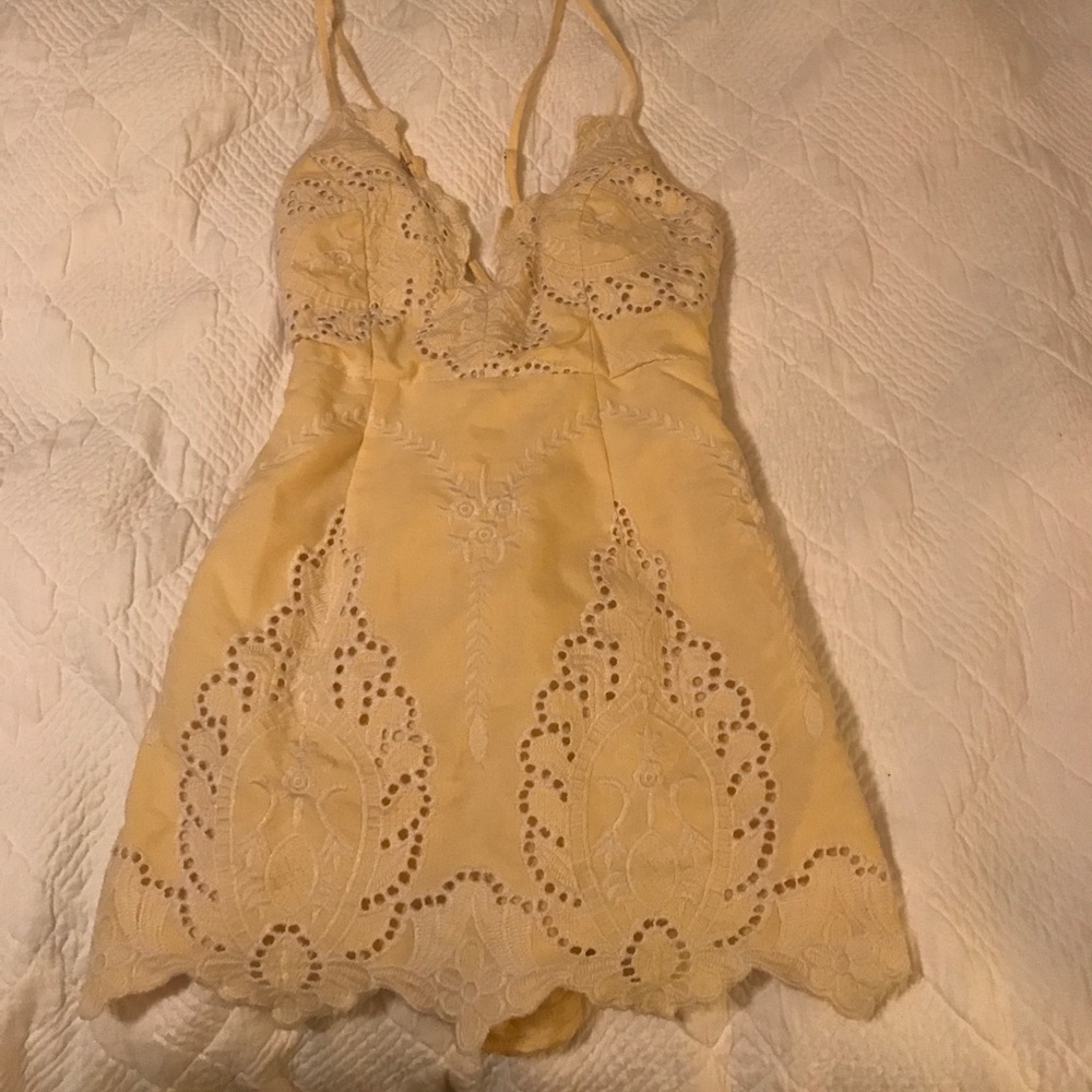 Yellow jumper with white embroidery