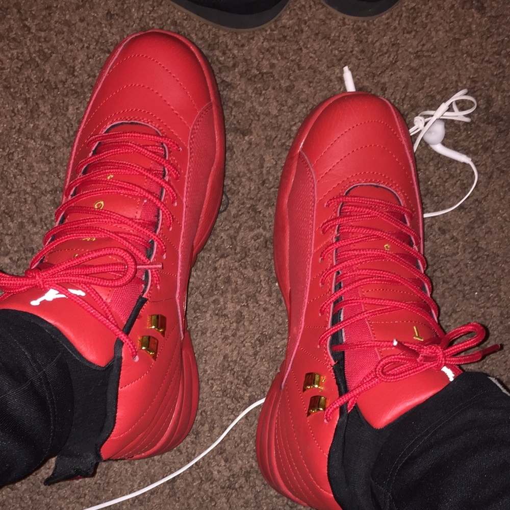 All red OVO Jordan 12s