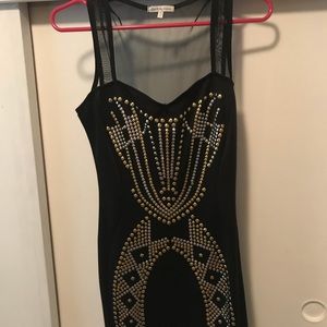 Black tight mini dress with sequenced pattern