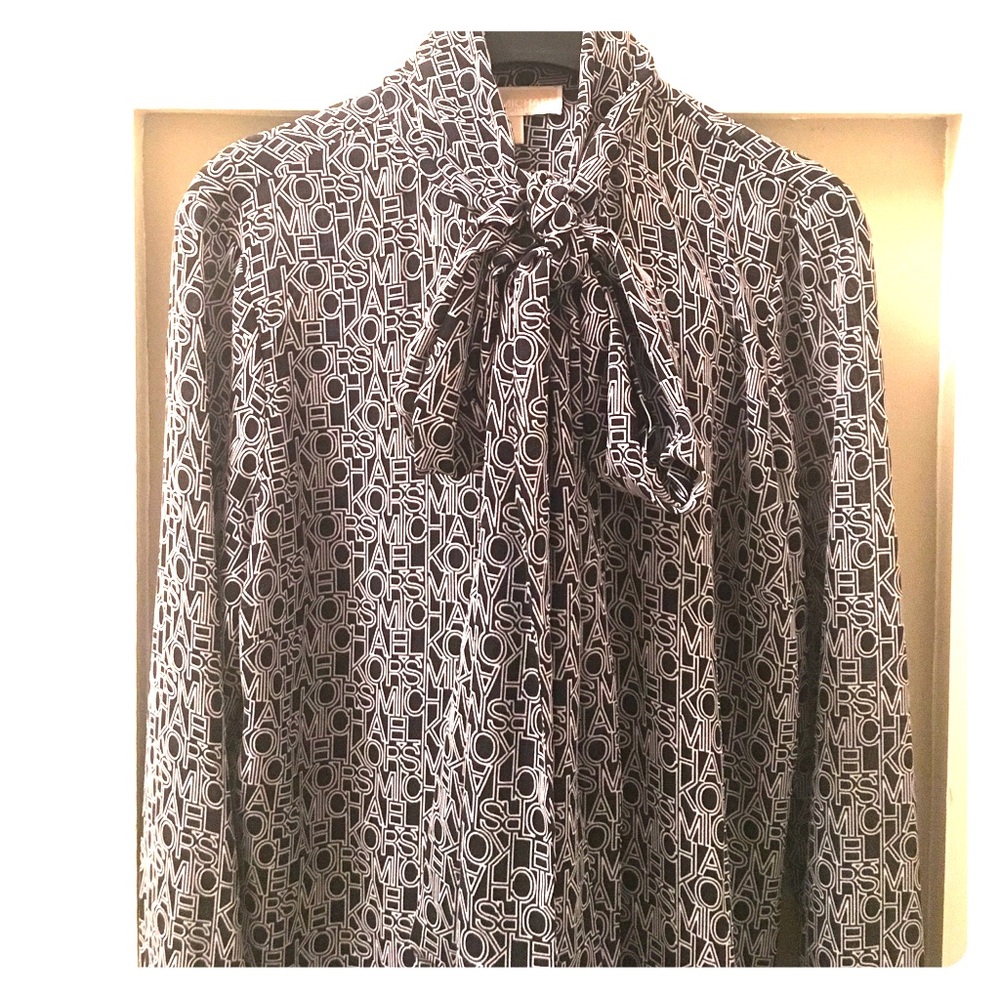 Michael Kors signature look with pussy bow design.