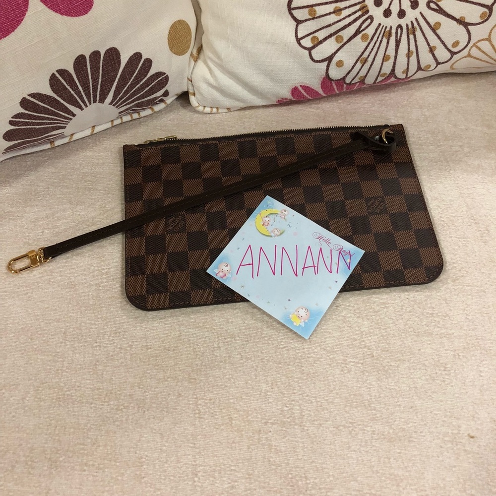 Brand new Neverfull pouch