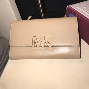 MK wallet, cream, extremely roomy.