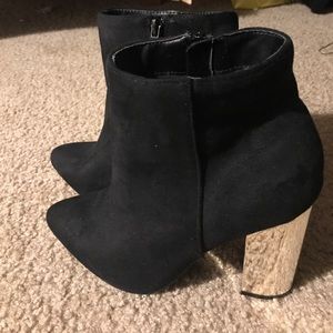 black booties with gold heel