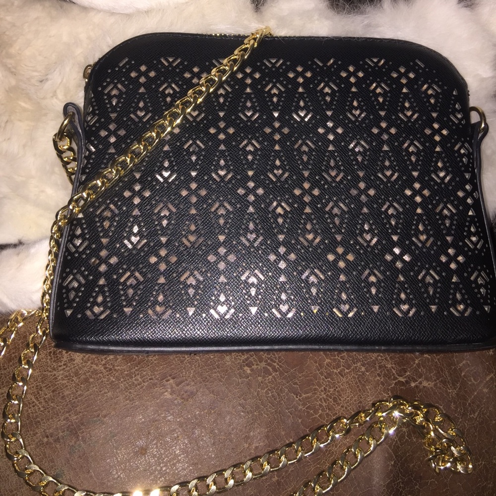 Small black and gold cross body purse