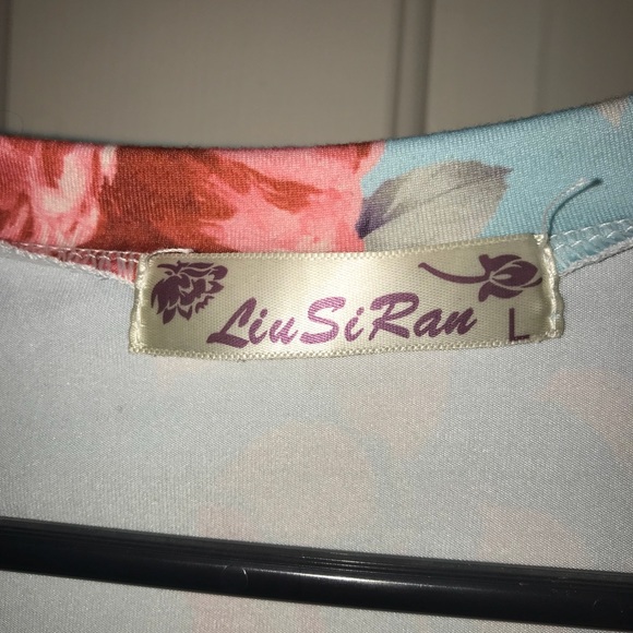 Turquoise floral w/ black & white stripe sleeves. - Picture 3 of 3