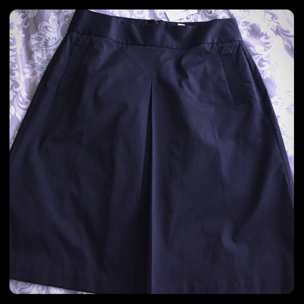 Cute navy skirt, front pleat. Cotton/nylon/spandex