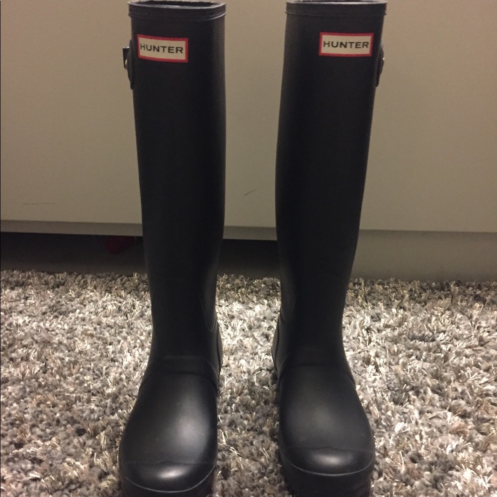 Black tall hunter boots