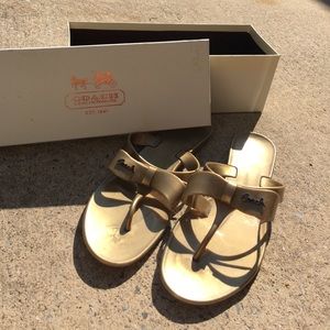 Coach gold bow flip flops