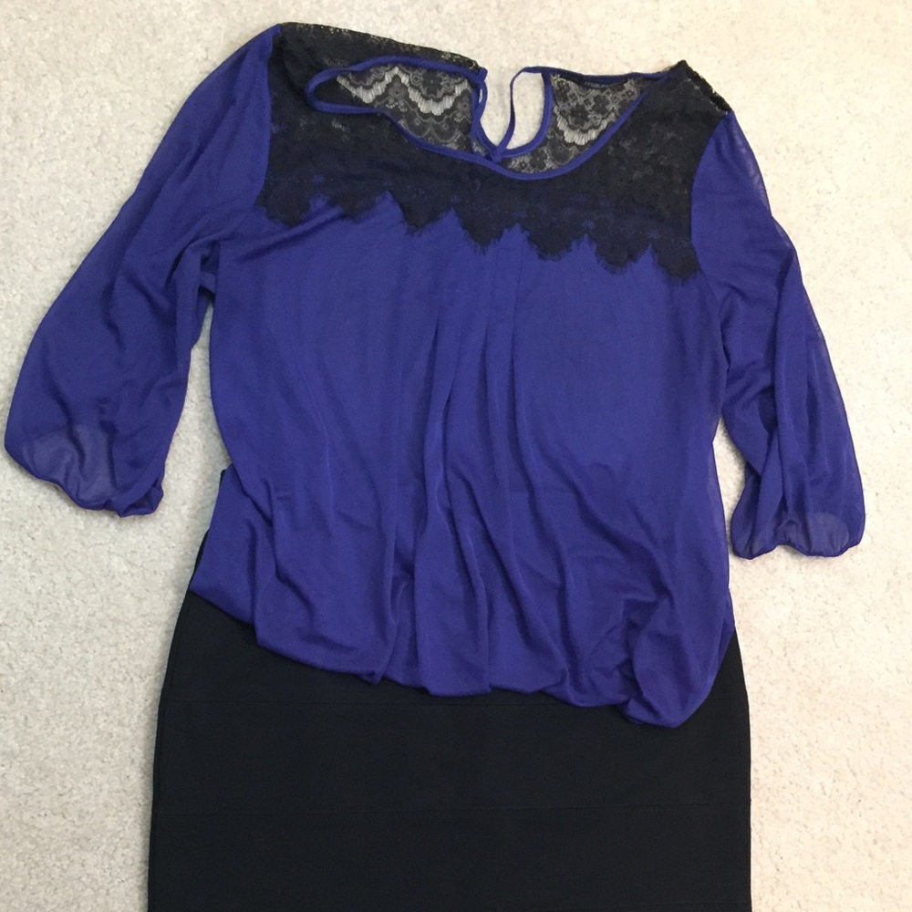 Blue blouse with lace detail.