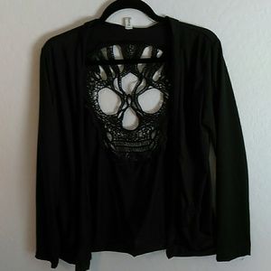 Black cardigan with skull design.