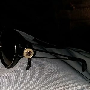 Gold frames turtle Back Versace shades
