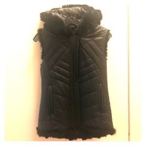 Reversible fur and faux leather vest.