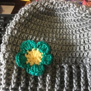 Crochet messy bun beanie with flower