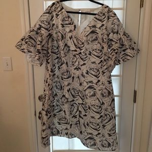 Silk sheath dress with delightful bell sleeves.