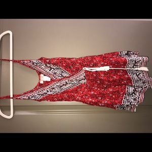 Red detailed romper with tassel