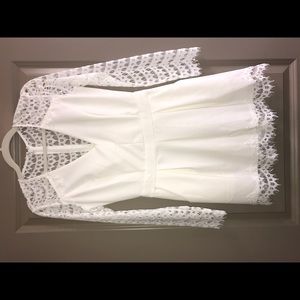 White long sleeve romper with lace detail
